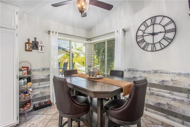 a view of a chairs and table in patio
