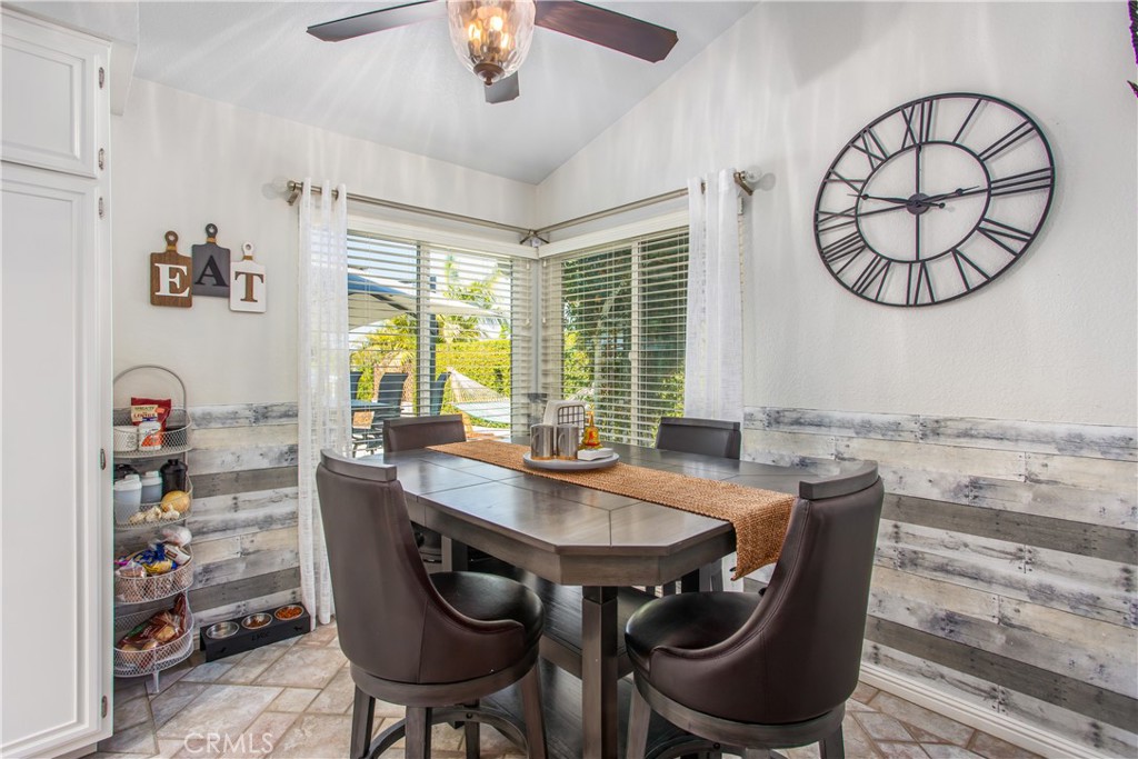 16455 Lake Knoll Parkway Riverside, CA 92503 - Photo 20 of 59 a view of a dining room with furniture window and wooden floor