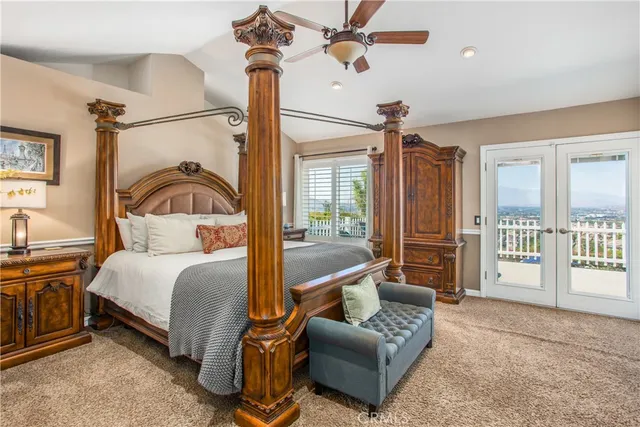 a view of tall buildings and swimming pool with seating area