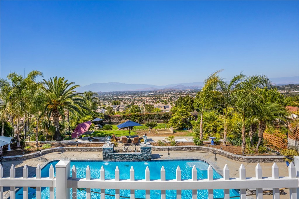 16455 Lake Knoll Parkway Riverside, CA 92503 - Photo 25 of 59 a view of tall buildings and swimming pool with seating area