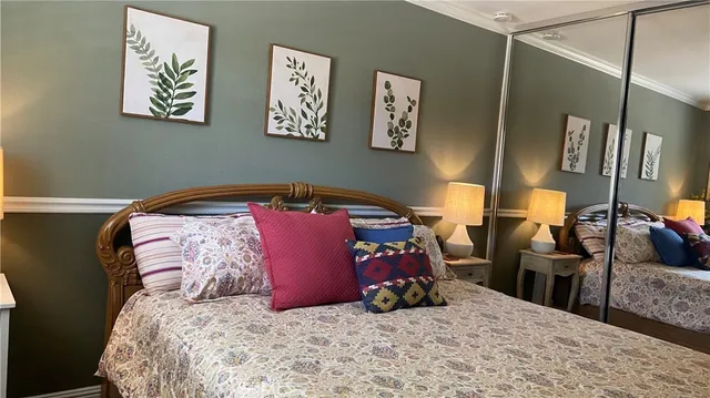 a bathroom with a granite countertop toilet a sink and a mirror