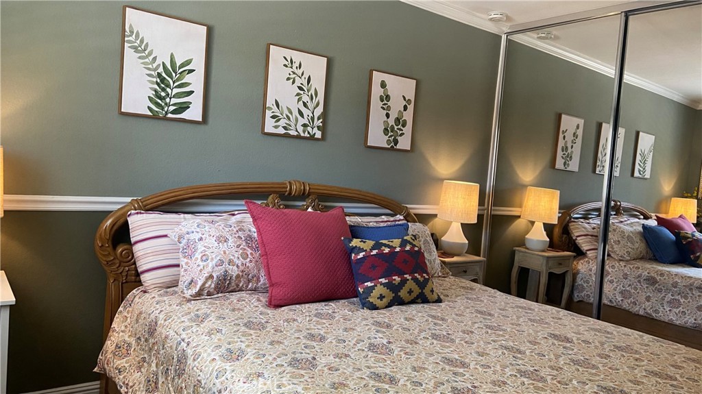 16455 Lake Knoll Parkway Riverside, CA 92503 - Photo 32 of 59 a bed room with a bed and a couch