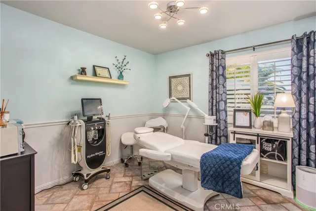 a building outdoor space with patio furniture and potted plants