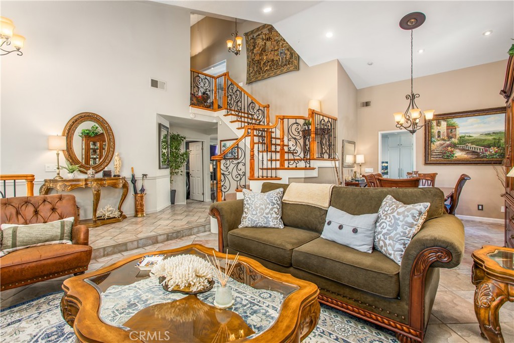 16455 Lake Knoll Parkway Riverside, CA 92503 - Photo 4 of 59 a living room with furniture and a chandelier