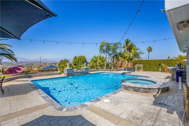 a view of a swimming pool with sitting area