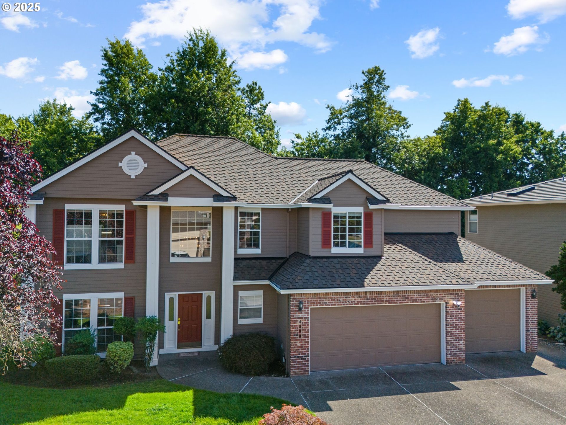 4000 Southwest 30th Drive Gresham, OR 97080 - Photo 2 of 47 a front view of a house with a yard and garage