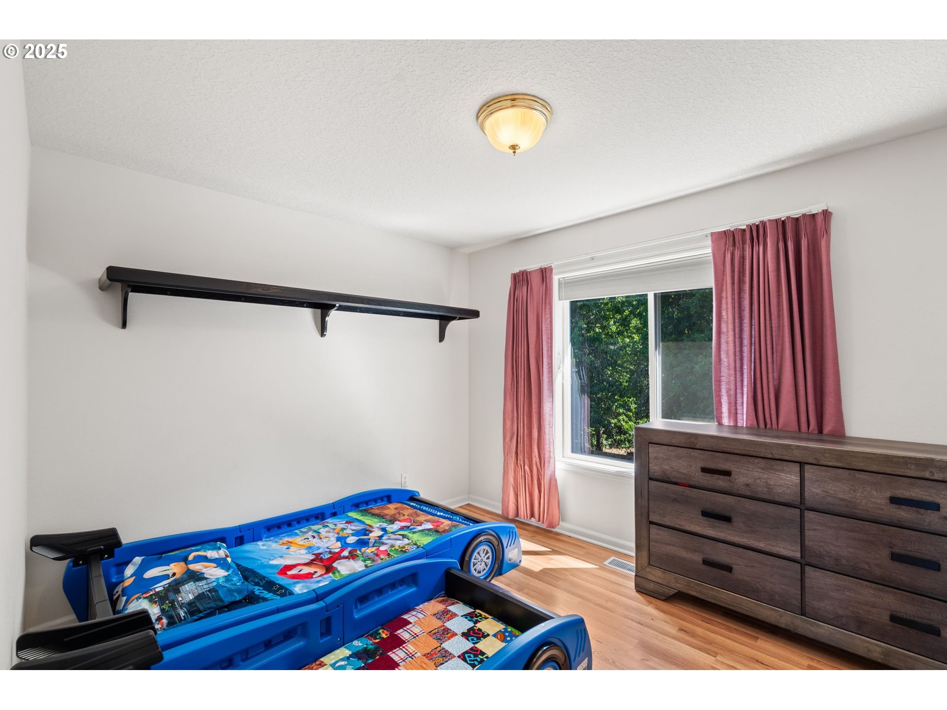 4000 Southwest 30th Drive Gresham, OR 97080 - Photo 28 of 47 a view of a bedroom with toys and dresser