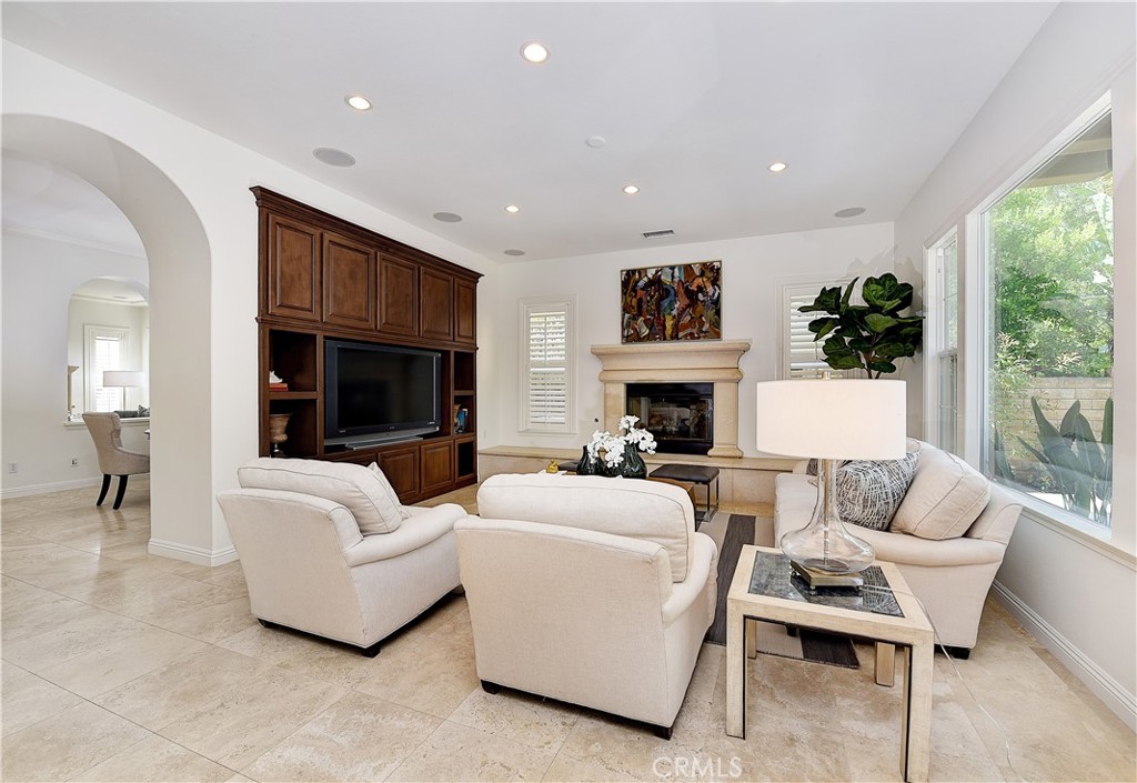 10 Elissa Lane Ladera Ranch, CA 92694 - Photo 11 of 23 a living room with furniture a fireplace and a large window