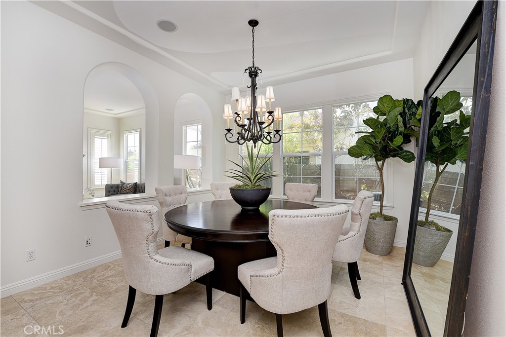 10 Elissa Lane Ladera Ranch, CA 92694 - Photo 12 of 23 a dining room with furniture potted plants and wooden floor