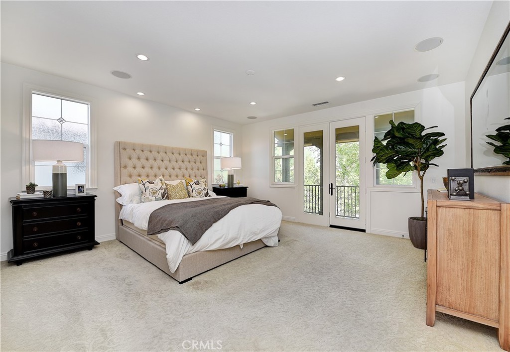 10 Elissa Lane Ladera Ranch, CA 92694 - Photo 14 of 23 a spacious bedroom with a bed and a large window