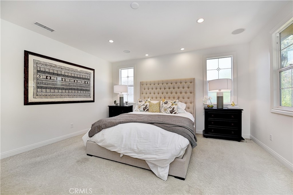 10 Elissa Lane Ladera Ranch, CA 92694 - Photo 15 of 23 a spacious bedroom with a bed and a window