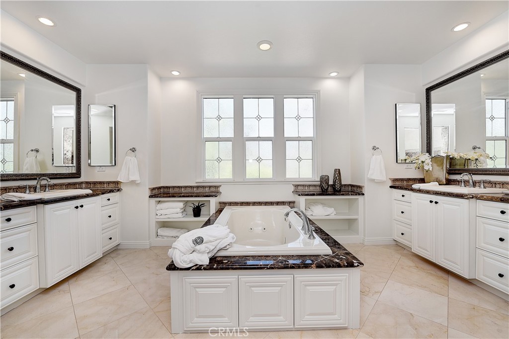 10 Elissa Lane Ladera Ranch, CA 92694 - Photo 16 of 23 a kitchen with granite countertop white cabinets and appliances