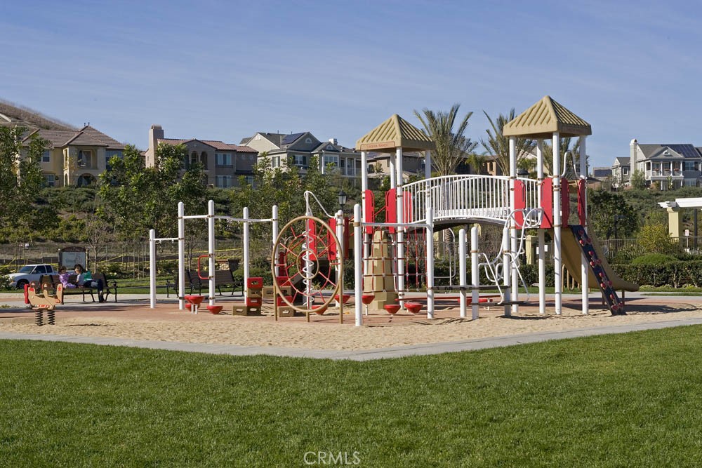 10 Elissa Lane Ladera Ranch, CA 92694 - Photo 22 of 23 a front view of multi story residential apartment building with outdoor seating and floor to ceiling window