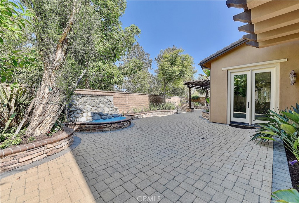 10 Elissa Lane Ladera Ranch, CA 92694 - Photo 3 of 23 a view of a patio with table and chairs and potted plants