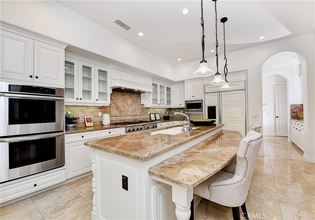 10 Elissa Lane Ladera Ranch, CA 92694 - Photo 5 of 23 a kitchen with stainless steel appliances granite countertop a stove a sink and a microwave