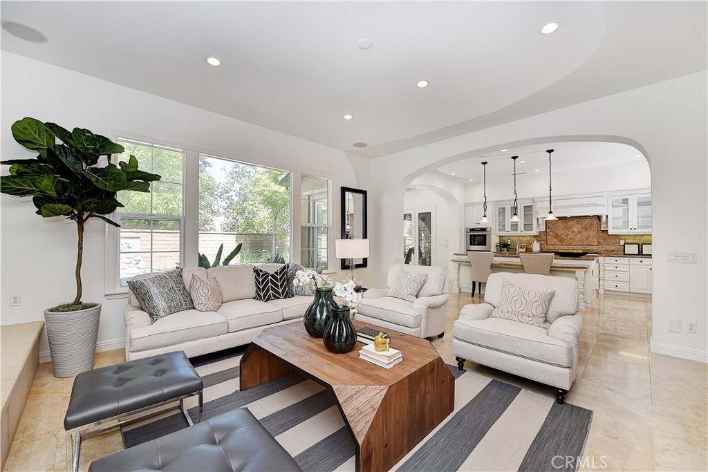 10 Elissa Lane Ladera Ranch, CA 92694 - Photo 9 of 23 a living room with furniture a chandelier and a potted plant