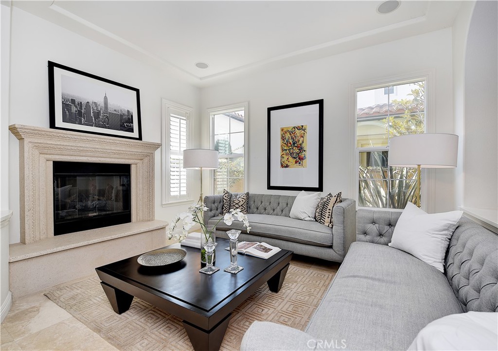 10 Elissa Lane Ladera Ranch, CA 92694 - Photo 10 of 23 a living room with furniture a rug a window and a fireplace