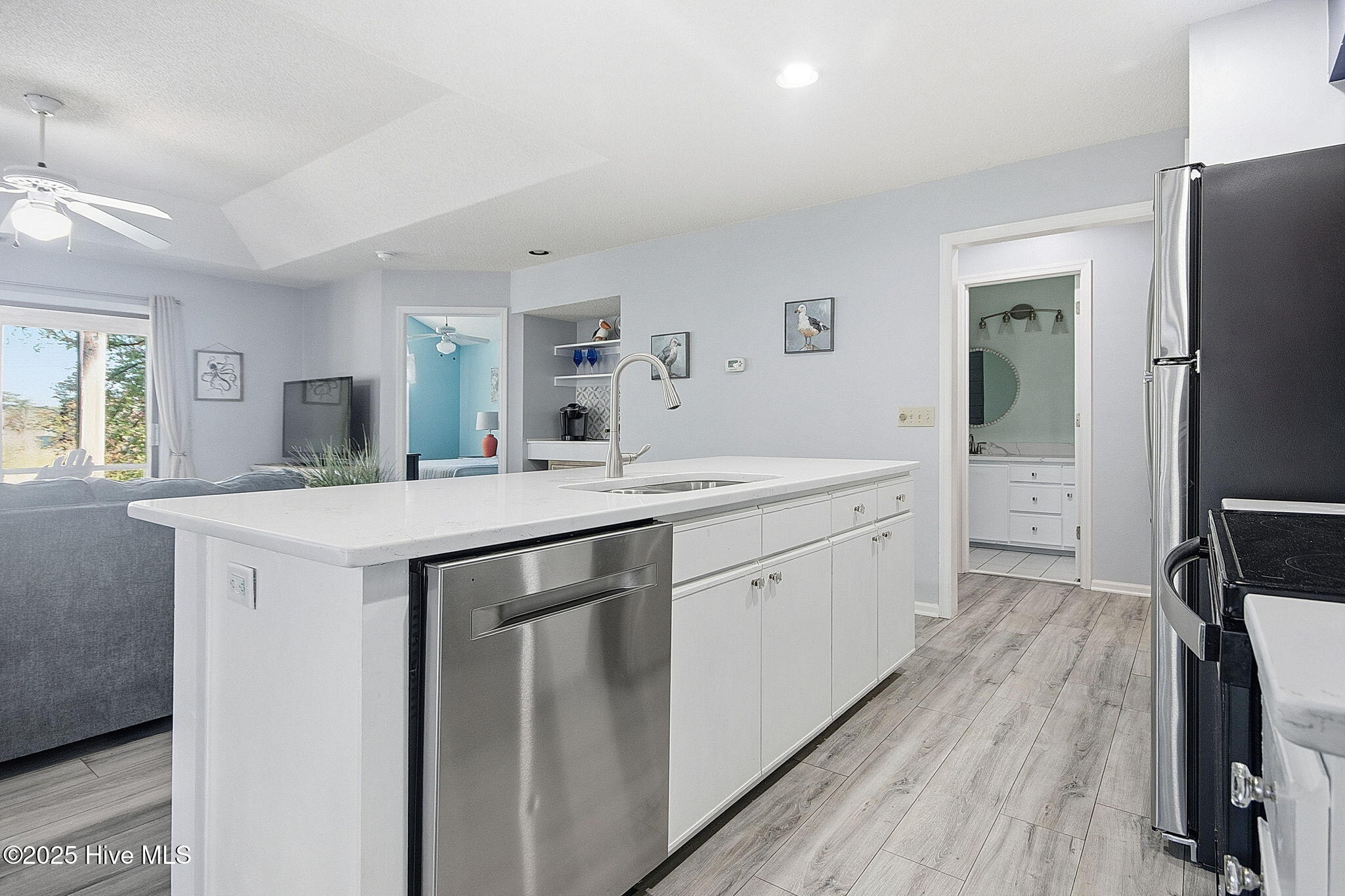 223 Clubhouse Road, Unit 5 Sunset Beach, NC 28468 - Photo 6 of 35 Kitchen upgrades include Quartz Counter Tops and Tile Backsplash along with a newer microwave!