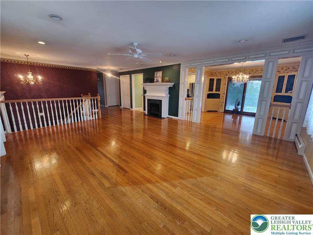 1480 Teels Road Pen Argyl, PA 18072 - Photo 6 of 18 Gleaming hardwood floors and a classic fireplace define this expansive main living area.