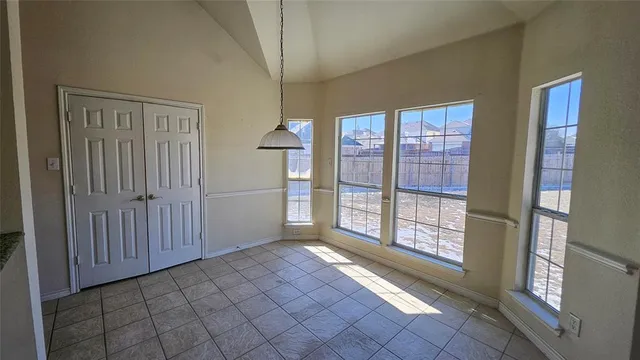 a view of empty room with windows