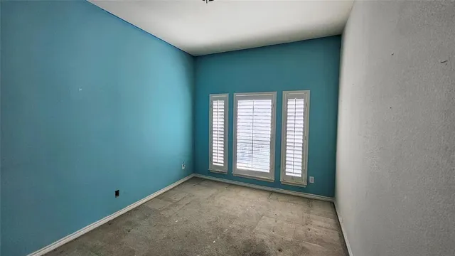 an empty room with windows