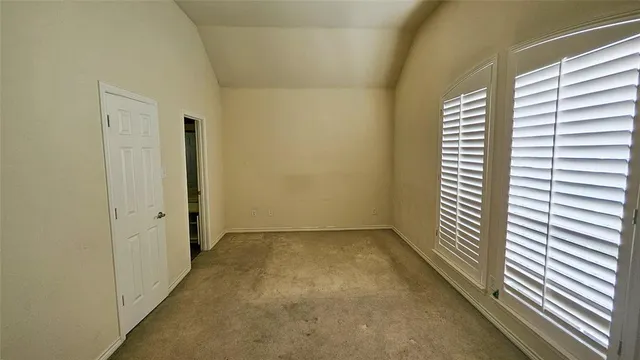 a view of a room with a large window