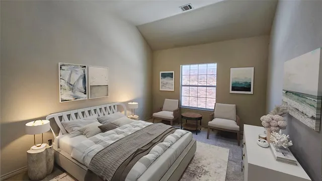 a bedroom with bed couch and window