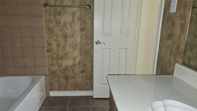 a bathroom with a shower and a bathtub