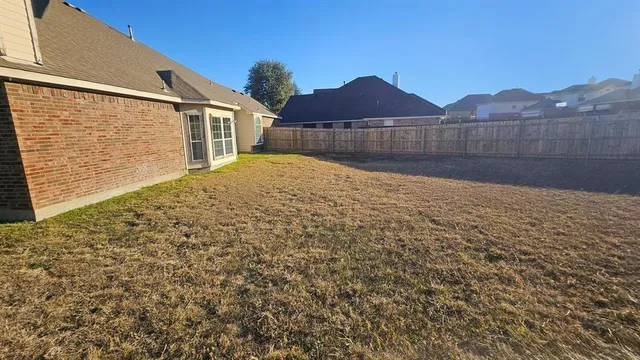a view of a backyard with a garden and mountain view