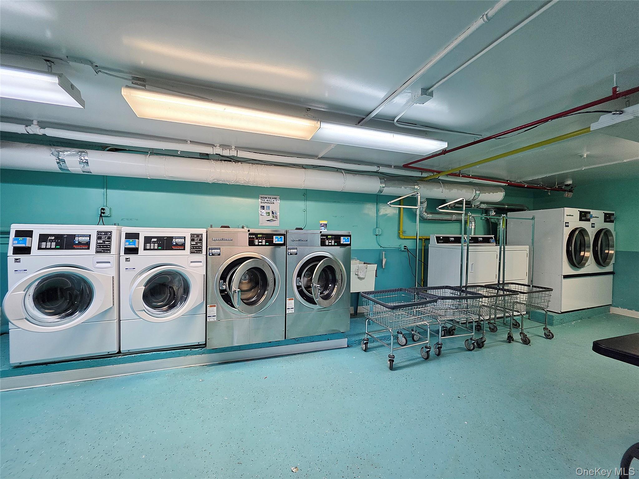 219-12 75th Avenue, Unit LOWR Queens, NY 11364 - Photo 20 of 22 a utility room with dryer and washer