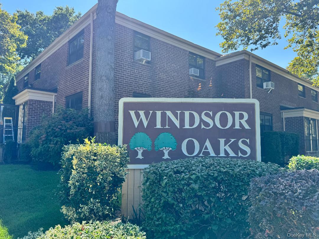 219-12 75th Avenue, Unit LOWR Queens, NY 11364 - Photo 2 of 22 a sign on the side of a building