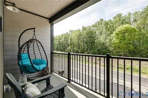 a view of a balcony with wooden floor