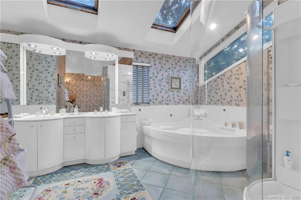 940 Durham Road Wallingford, CT 06492 - Photo 26 of 40 The Primary Bathroom W/ Tub & Glass Shower.