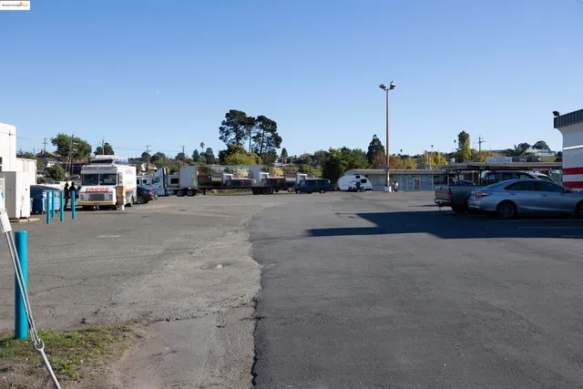a view of a city street with cars