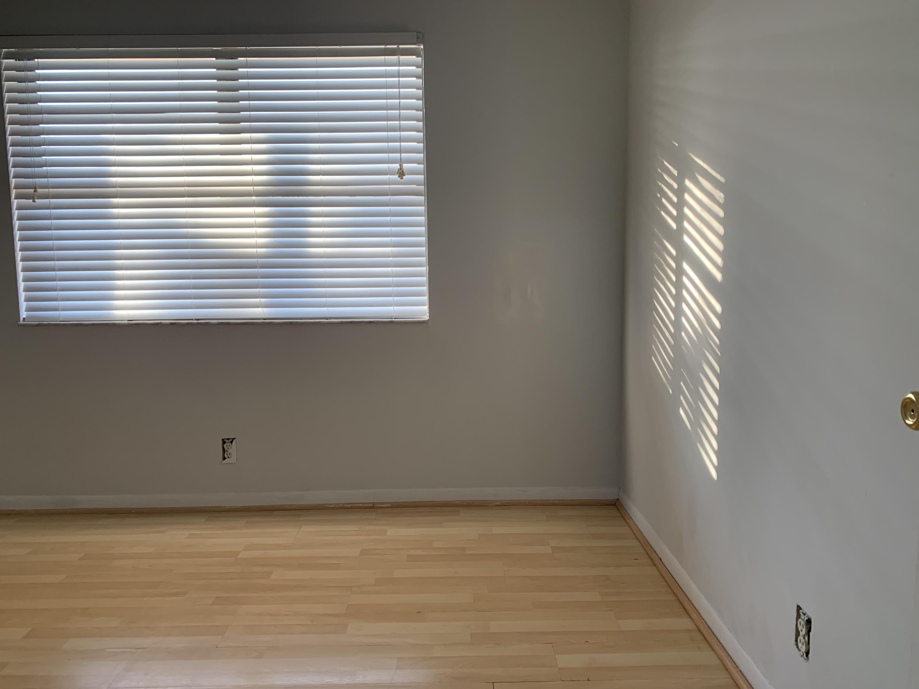 9370 Southwest 8th Street, Unit 202 Boca Raton, FL 33428 - Photo 17 of 46 a view of an empty room with a window
