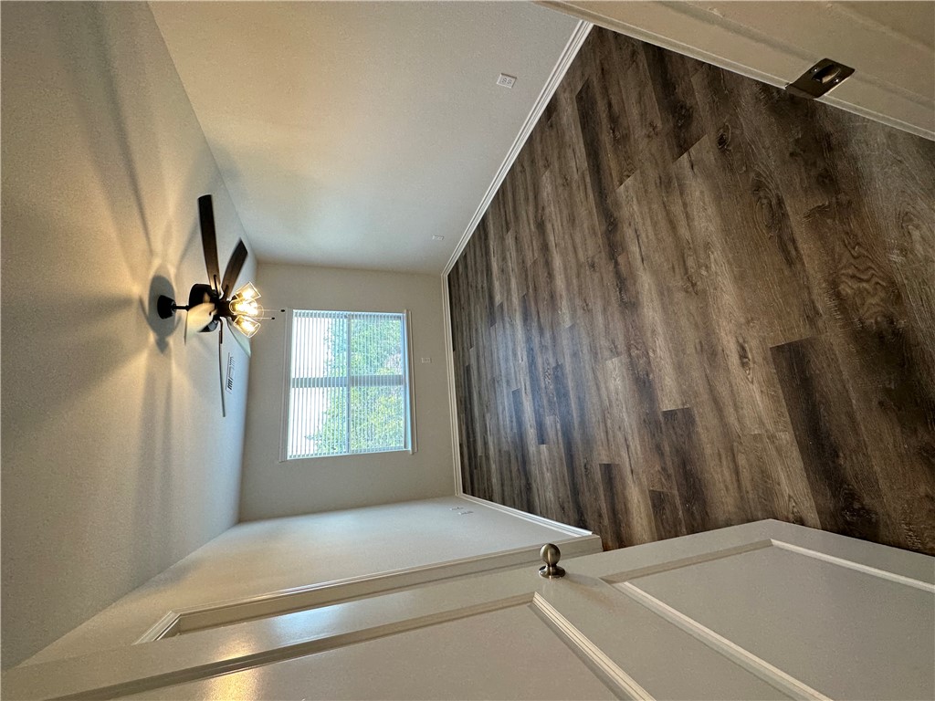11144-11142 Stillwater Road College Station, TX 77845 - Photo 20 of 22 Unfurnished room with dark wood finished floors and a textured ceiling
