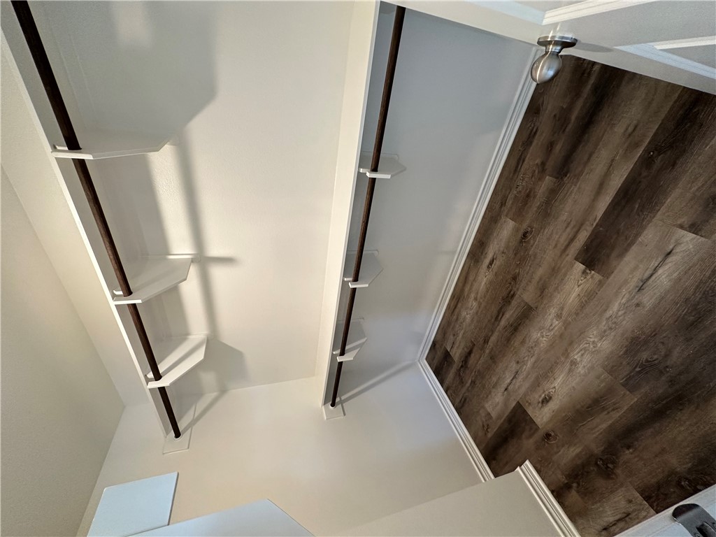 11144-11142 Stillwater Road College Station, TX 77845 - Photo 21 of 22 Walk in closet with dark wood-type flooring