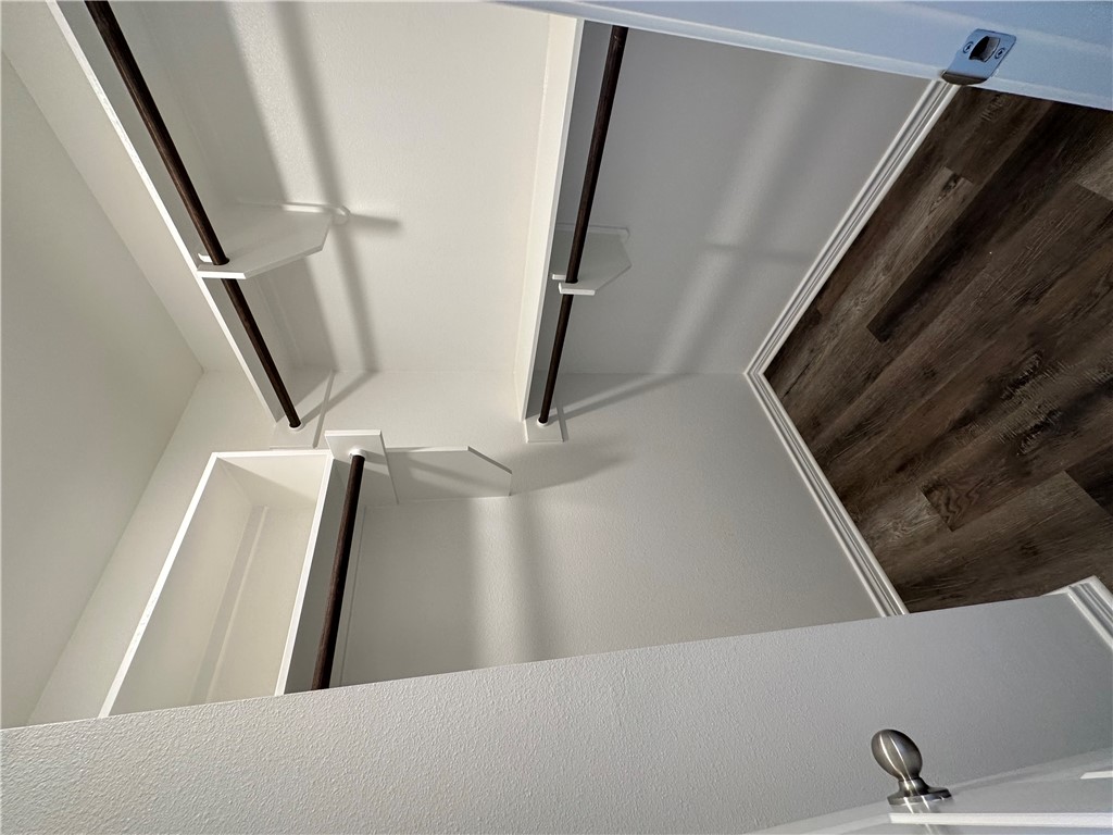 11144-11142 Stillwater Road College Station, TX 77845 - Photo 22 of 22 Walk in closet featuring dark wood finished floors
