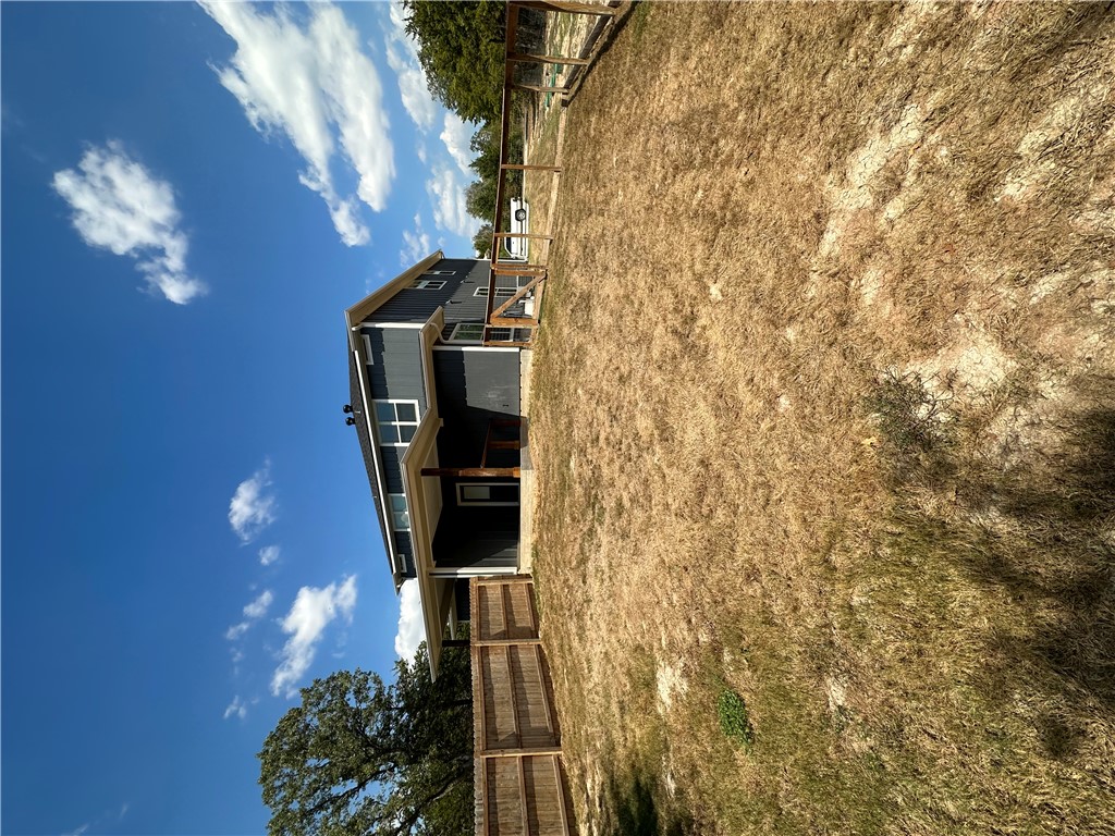 11144-11142 Stillwater Road College Station, TX 77845 - Photo 3 of 22 Rear view of house with a patio area and a fenced backyard