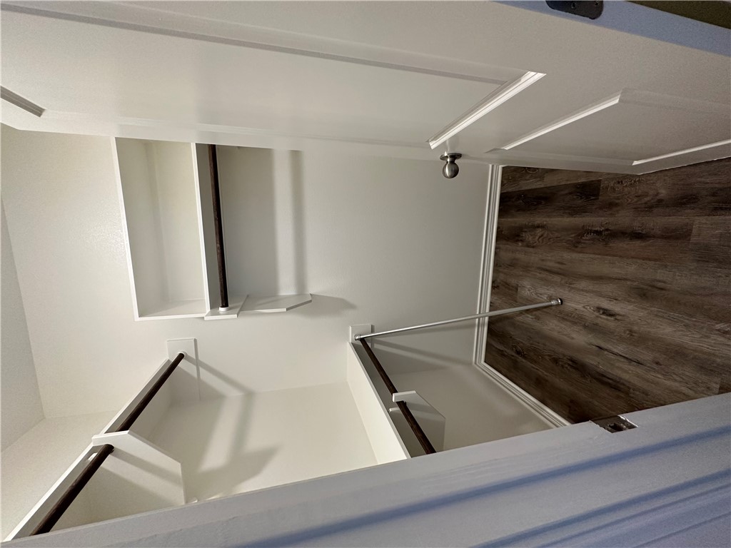 11144-11142 Stillwater Road College Station, TX 77845 - Photo 7 of 22 Spacious closet with dark wood-style floors
