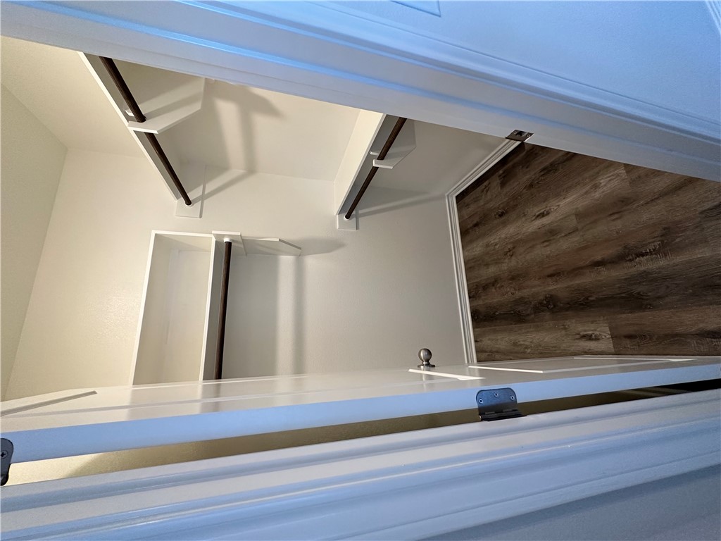 11144-11142 Stillwater Road College Station, TX 77845 - Photo 8 of 22 Spacious closet featuring dark wood-style flooring
