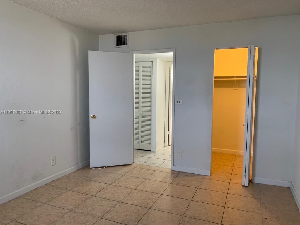 Yolanda Villas Condominiums Miami, FL 33126 - Photo 6 of 10 a view of room with windows