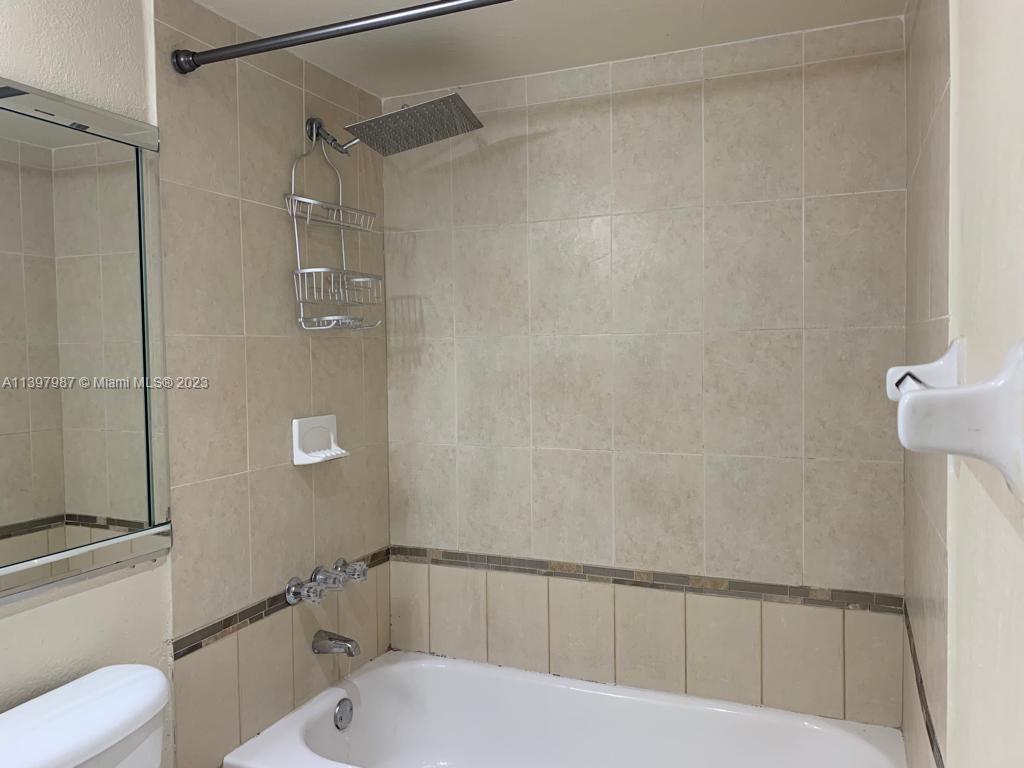 Yolanda Villas Condominiums Miami, FL 33126 - Photo 8 of 10 a bathroom with a toilet and shower