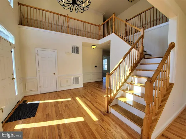 a view of entryway with wooden floor