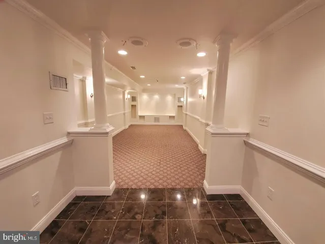 a view of a hallway with a chair