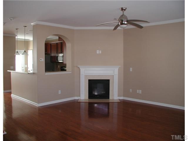 9222 Wooden Road Raleigh, NC 27617 - Photo 5 of 18 Family Room opens to kitchen and has a cultured-marble profile fireplace with gas logs.