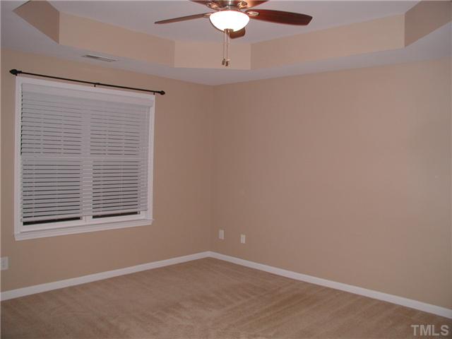 9222 Wooden Road Raleigh, NC 27617 - Photo 9 of 18 14'x13' master bedroom on third floor with ceiling fan and tray ceiling. Walk-in closet.