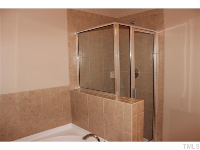 9222 Wooden Road Raleigh, NC 27617 - Photo 10 of 18 Master bath has vaulted ceiling, tiled floors, separate shower and garden tub