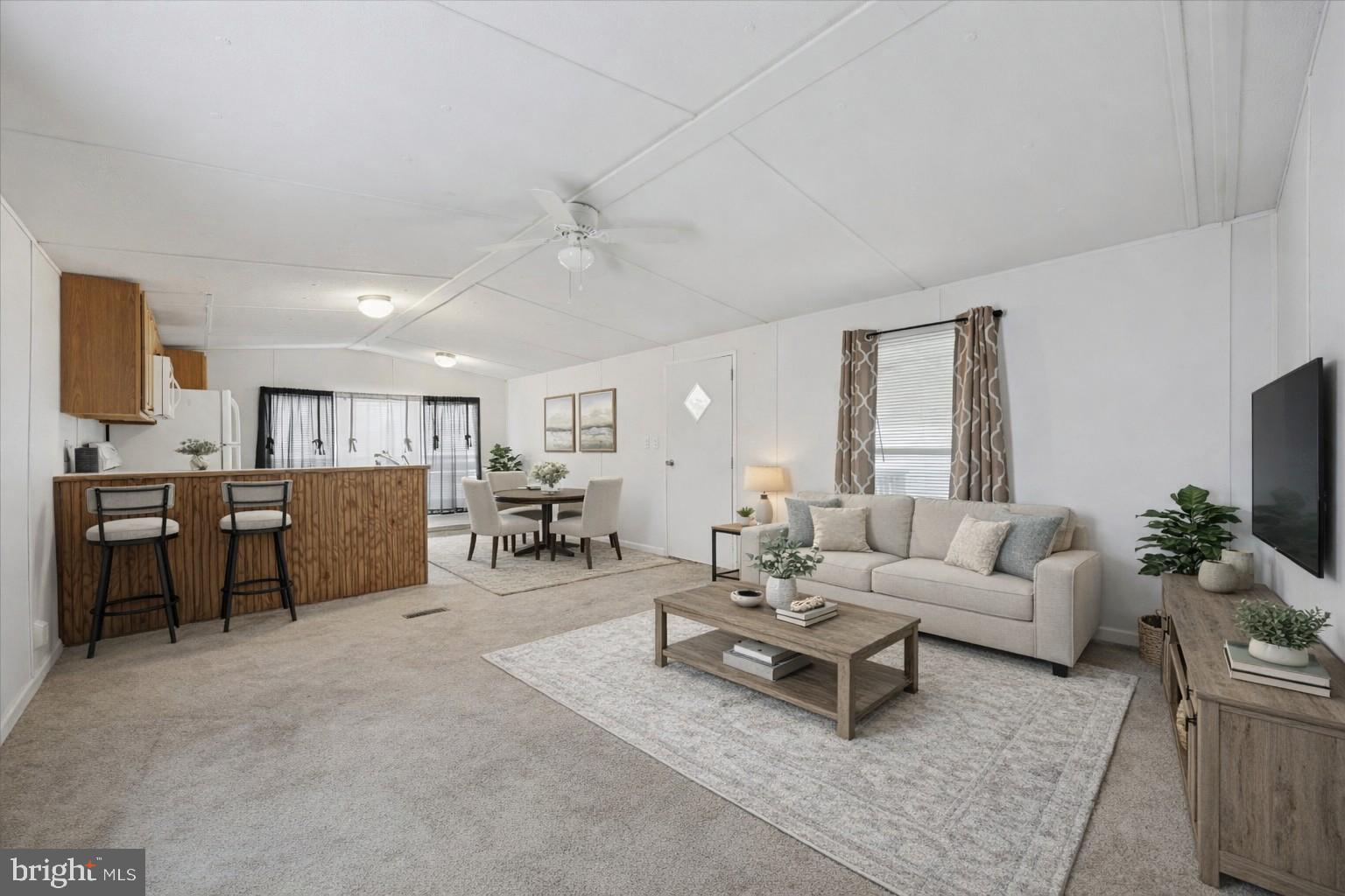 Virtually staged living room and kitchen