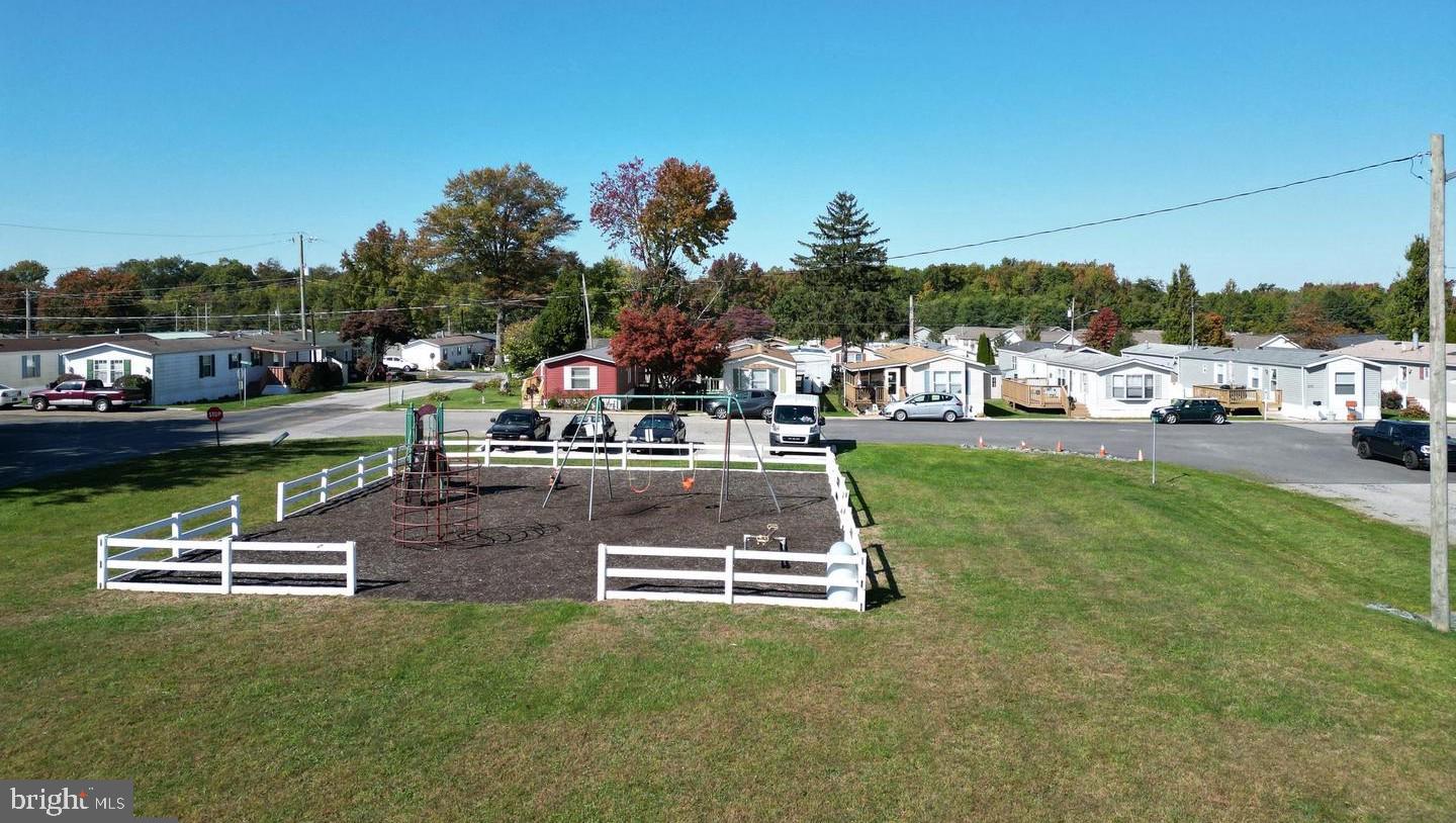 20 Winterset Road Wilmington, DE 19810 - Photo 13 of 14 a swimming pool with some trees in the background